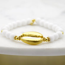 Load image into Gallery viewer, Large Cowrie Shell on white bead bracelet