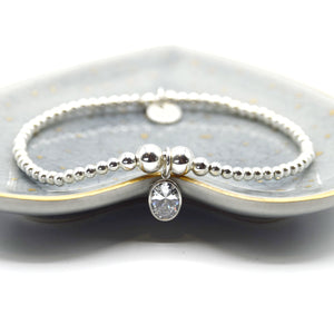 Large oval CZ charm beaded bracelet