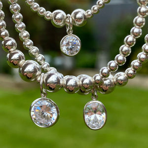 Large oval CZ charm beaded bracelet