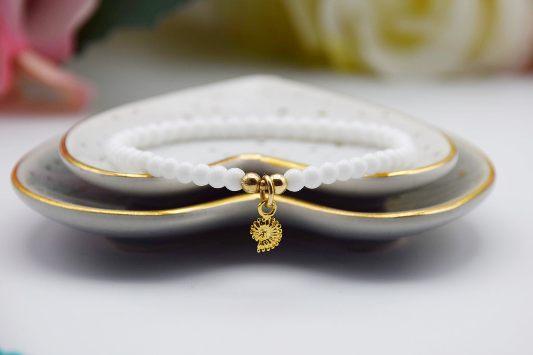 Gold Mini Fossil Charm White Bead Bracelet